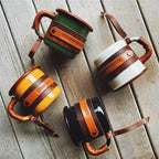 Enamel camp mug with stitched leather sleeve