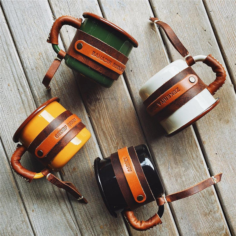 Enamel camp mug with stitched leather sleeve